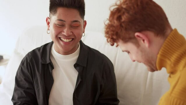 Gay man applying eye shadow to a man at home