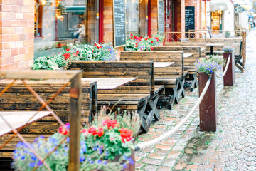 Terrace seats of a restaurant decorated with cute flowers,