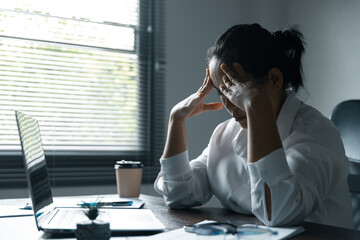 A woman battles depression and stress in her workplace, highlighting the challenges faced by...