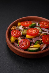 Delicious fresh salad with beef slices, cherry tomatoes, sweet peppers