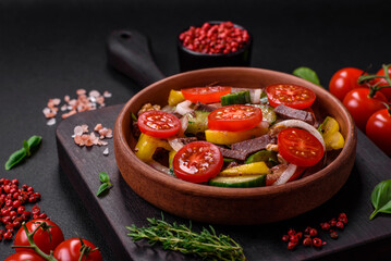 Delicious fresh salad with beef slices, cherry tomatoes, sweet peppers