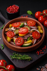 Delicious fresh salad with beef slices, cherry tomatoes, sweet peppers