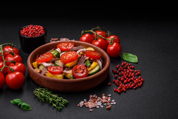 Delicious fresh salad with beef slices, cherry tomatoes, sweet peppers
