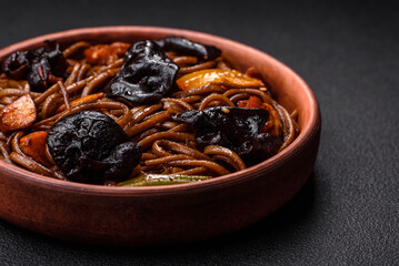 Delicious fresh buckwheat noodles or udon with mushrooms, peppers and other vegetables