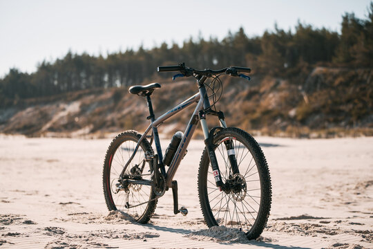 13.05.2023 Poland, Baltic sea, Europe. Modern bicycle on the beach. Vacation life and recreation concept. Fitness sports motivation and inspiration. MTB on the seaside