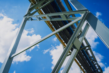 Modern steam pipeline for industrial on blue skies background.