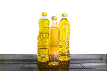 Bottles of vegetable or cooking oil on the table. isolated on white background.PNG