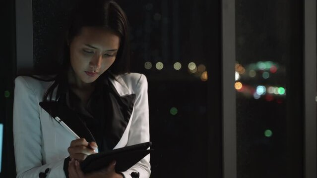 Businesswoman with tablet and smart pencil. Young discussing and consult planning with brainstorming meeting. Business woman planning and trading with negotiate partnership.