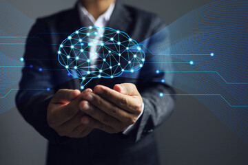 Businessman holding the human brain to research idea brain strom information, transmission, nerve endings to brain cells and recording of various information