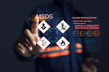 Safety officers pointing hands at the MSDS or material safety data sheet to indicate chemical...