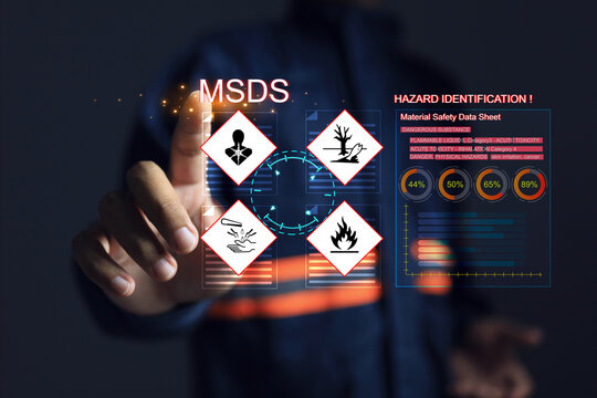 Safety officers pointing hands at the MSDS or material safety data sheet to indicate chemical information, basic antidotes or hazards to the body in area of use for emergency case safety work concept