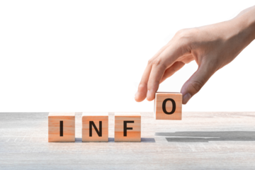 Placing a wooden block with the text "INFO" on a wooden table. on a white background. Business concept for a successful growth process.PNG	