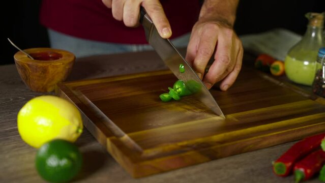 Cutting Green Jalapeno on the board