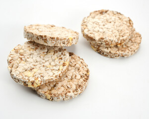 healthy diet light and crispy bread without yeast from whole grains on a white background, close-up