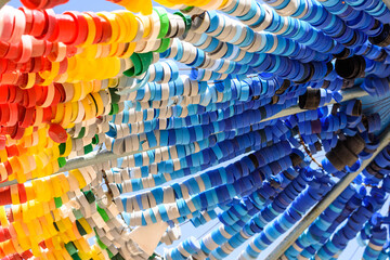 Colorful plastic bottle caps on sun umbrellas. Recycle, Reuse, Reduce waste. Zero waste