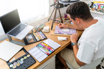 Watercolor Whiz: Gay Watercolorist Showcasing Technical Skill in Studio