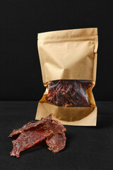 Dry beef jerky meat in paper package
