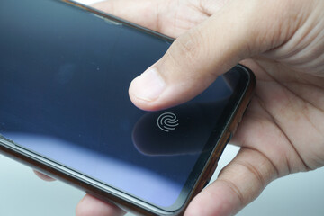Fingerprint scanner on the phone screen. Touch screen smartphone with a zone to touch the human...