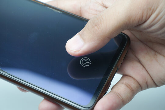 Fingerprint scanner on the phone screen. Touch screen smartphone with a zone to touch the human finger, to unlock the device.
