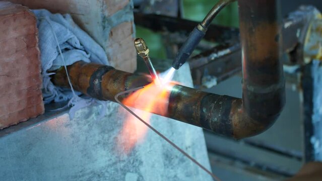soldering copper pipes with a gas burner