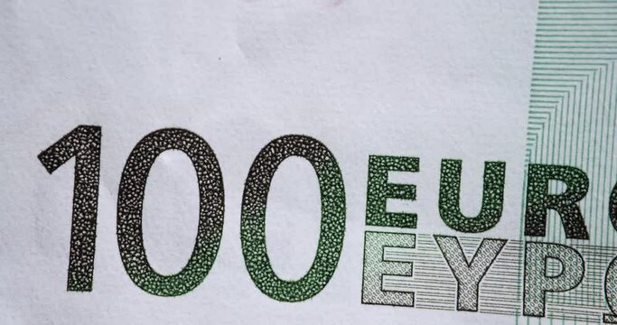 Various watermarks on dollars and euros in denominations of 50 and time lapse cents. World money currencies and financial crisis concept