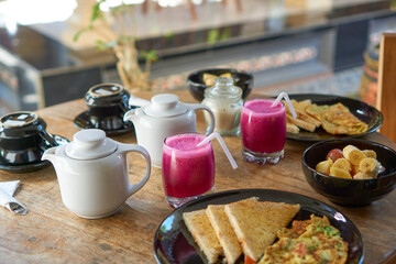 Toast, omelette, juice, coffee and tea for breakfast