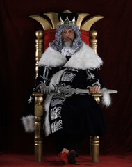 portrait of an old king on the throne
