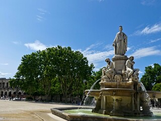 Fototapeta premium Nîmes, May 2023 : Visit the beautiful city of Nîmes en Provence - Historical city with its arena and ancient theater - View on the city