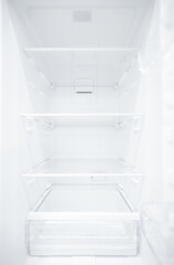 An empty refrigerator. Inside an empty, clean refrigerator, a refrigerator compartment after defrosting. shot with a wide angle lens