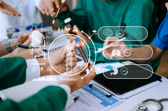 Medical technology network team meeting concept. Doctor hand working with smart phone modern digital tablet and laptop computer with graphics chart interface, with virtual icon diagram.