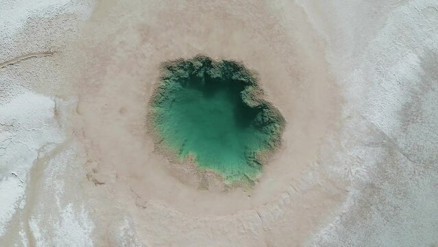 Drone footage of the famous tourist attraction Ojos del Mar near Tolar Grande in the Argentinian highlands called Puna in South America - natural look