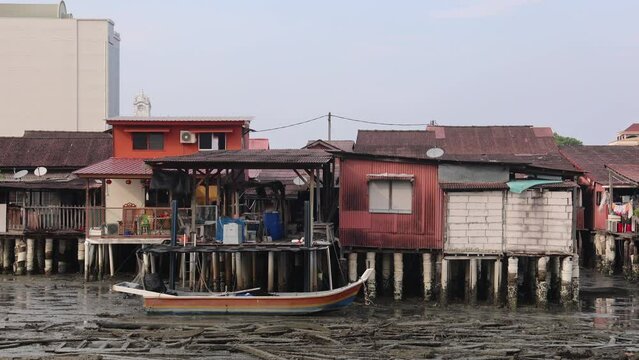 Fishing boats on the water in Old Chew Jetty in George Town, Penang, Malaysia
