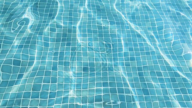 Refreshing Luxury: Blue Tiled Pool in Summer Hea