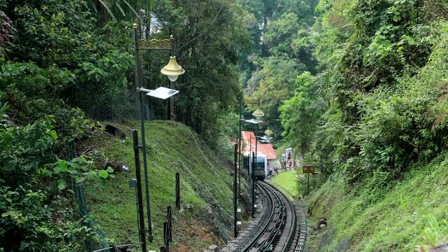 GEORGE TOWN, MALAYSIA - APRIL 20, 2023: The funicular in George Town city descends from the top station on Penang hill
