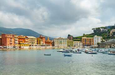 mediterranean coast in italy, against the backdrop of colorful houses on the seashore, many boats