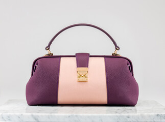 Luxury women 's bag. Luxury pink and purple leather handbag on white background, on marble floor. A elegant bag with a gold accessories. Fashionable trendy 