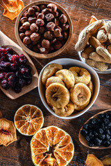 Composition with a variety of dried fruits and assorted nuts.