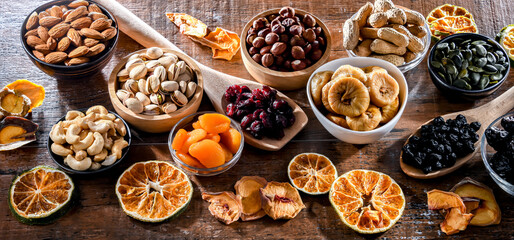 Composition with a variety of dried fruits and assorted nuts.