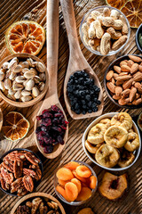 Composition with a variety of dried fruits and assorted nuts.