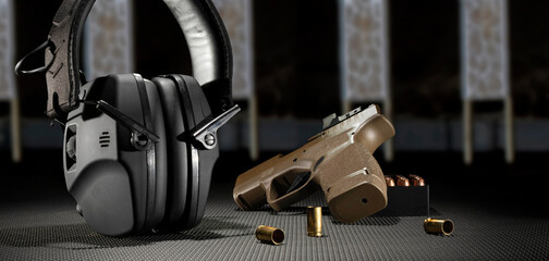 Electronic hearing protection with pistol and ammo