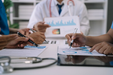 Medical team working on digital tablet healthcare doctor technology tablet using computer analyzed the results of medical reports, an online conference at the hospital.