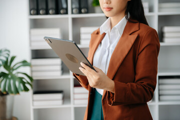 Working Process in Modern Office. Young Woman Account Manager Working at Table with New Business Project. Using Contemporary Laptop.