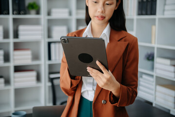 Working Process in Modern Office. Young Woman Account Manager Working at Table with New Business Project. Using Contemporary Laptop.