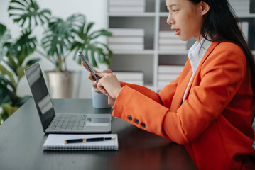 Working Process in Modern Office. Young Woman Account Manager Working at Table with New Business Project. Using Contemporary Laptop.