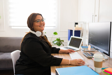 Beautiful female programmer developer smiling and coding