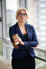 Adult young pretty business woman working at her office. She is very busy and hot.