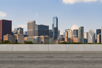 Empty urban asphalt road exterior with city buildings background. New modern highway concrete construction. Concept of way to success. Transportation logistic industry fast delivery. Chicago. USA.