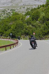 Obraz premium Bikers near near the top of the western ramp of the Stelvio Pass