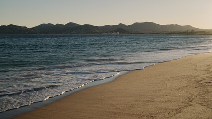 shot of evening waves on Cannes beach before sunset