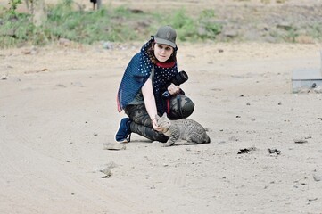 Photographer and Cat in outdoor. Woman Photographer Animalist. 